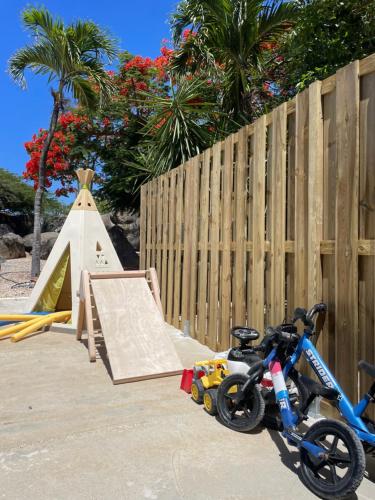 a bike is parked next to a skate ramp at 2 Bedrooms - Rock Palma Apartments in Noord