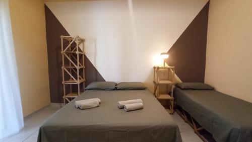 Postel nebo postele na pokoji v ubytování Casa Base