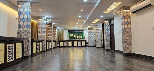 a hall with a row of tiles on the walls at Hotel Shree A unit of THC Group in Kota