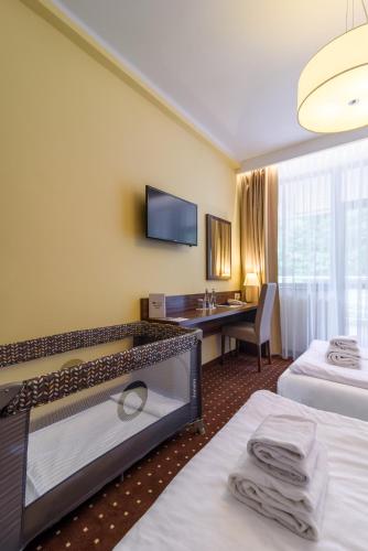 Postel nebo postele na pokoji v ubytování Hotel Podium