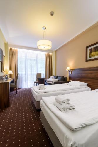 Postel nebo postele na pokoji v ubytování Hotel Podium
