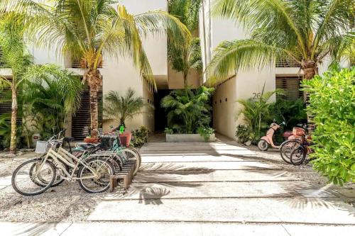 a group of bikes parked in front of a building at Bai-Ha Luxury 103 in Tulum