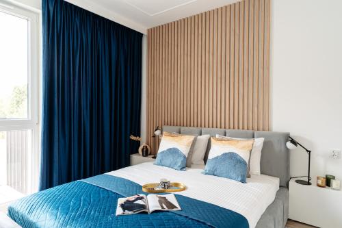 Katil atau katil-katil dalam bilik di Baltic Residence by LoftAffair