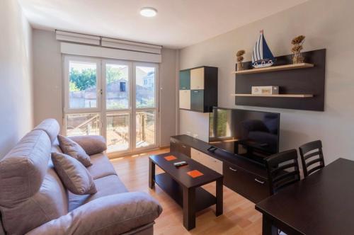 TV a/nebo společenská místnost v ubytování Apartamento Tira