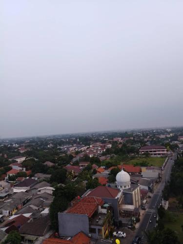 an aerial view of a city with a mosque at Apartemen Cibubur village by ipol in Cibubur