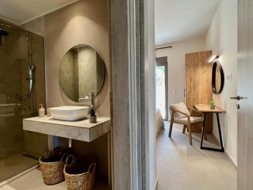 a bathroom with a sink and a mirror at Villa Karissa in Gavalochori