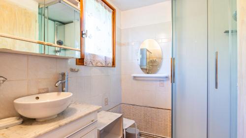 a bathroom with a sink and a mirror at 35 CHALET - Chalet lumineux 6 pers in Morillon
