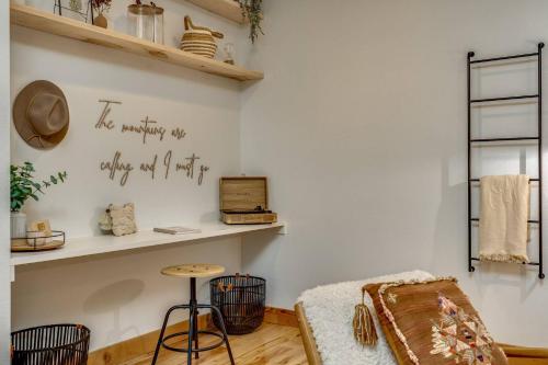 a living room with a white wall with a shelf at Brokenbridge Pond in Rhododendron