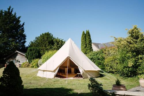 a large white tent in a yard at Montigo Resorts, Somerset in Shepton Mallet