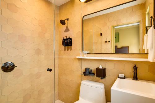 a bathroom with a shower and a toilet and a sink at Esme Miami Beach in Miami Beach