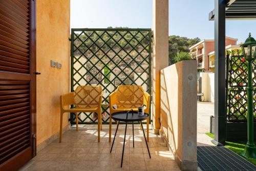 two chairs and a table on a patio at Casa Annabella in Sarroch