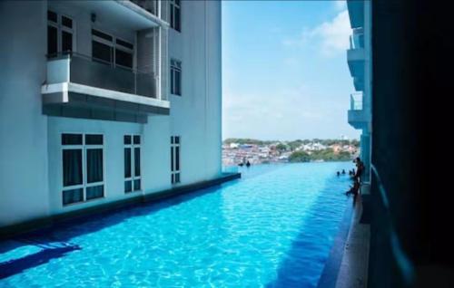 a view of a large pool of water between two buildings at KSL City Mall D'esplanade Muji Style Studio in Johor Bahru