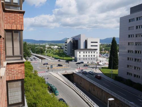 a view of a city with buildings and a street at Pensión Pamplonabeds in Pamplona