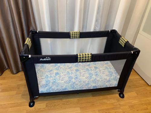 a black and yellow cart sitting on a floor at Gîte Bien-être in Yquebeuf