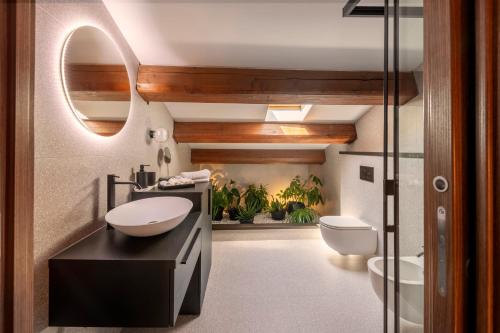a bathroom with a sink and a toilet at Dimora Condivi in Ripatransone