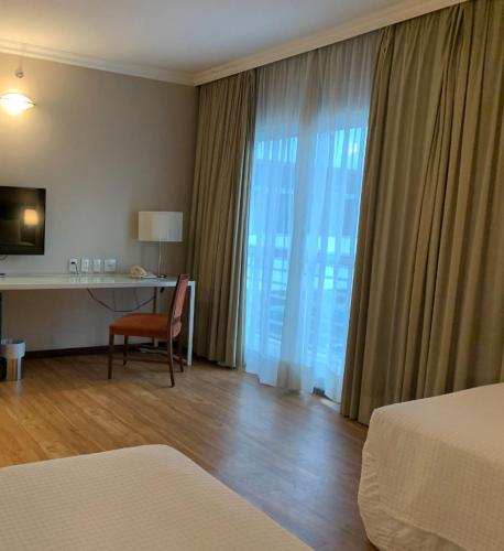 Ένα ή περισσότερα κρεβάτια σε δωμάτιο στο Blue Tree Premium Verbo Divino - Nações Unidas