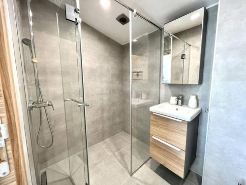 a bathroom with a shower and a sink at Villa Balchik in Balchik