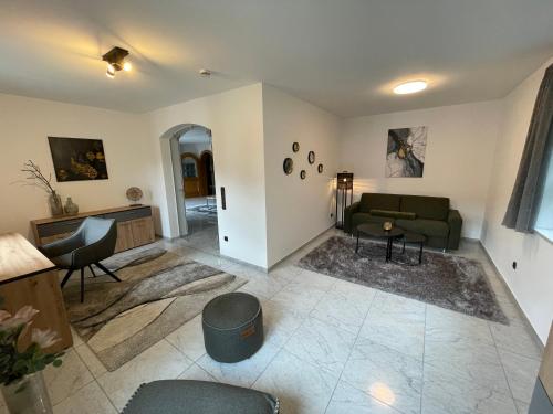a living room with a couch and a table at Ferienwohnung Bad Reichenhall (Nonn) in Bad Reichenhall