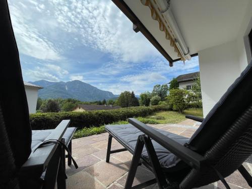 a patio with two chairs and a table with a view at Ferienwohnung Bad Reichenhall (Nonn) in Bad Reichenhall