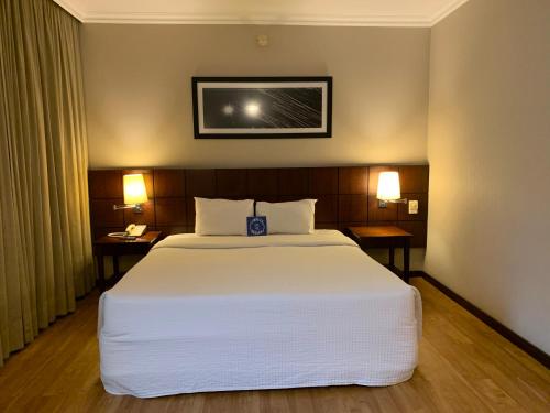 Ένα ή περισσότερα κρεβάτια σε δωμάτιο στο Blue Tree Premium Verbo Divino - Nações Unidas
