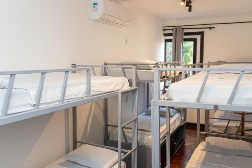 a group of bunk beds in a room at Pura Vida Hostel in Rio de Janeiro