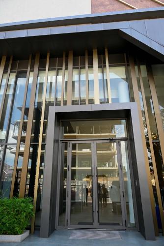 an entrance to a building with glass doors at The Broadway @The Lennox in Accra