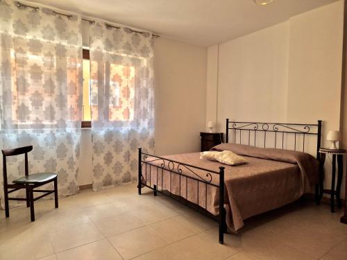 Letto o letti in una camera di La Chiostrina by TraMonti Apartments