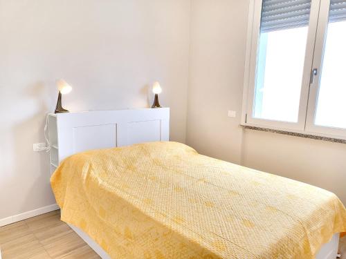 Postel nebo postele na pokoji v ubytování Rho Mind Fiera House