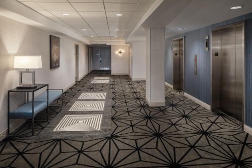 an office hallway with a floor with geometric tile at DoubleTree Suites by Hilton Hotel Detroit Downtown - Fort Shelby in Detroit