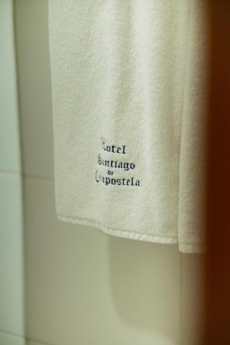 a towel with the words united marriage of nigeria on it at Hotel Santiago De Compostela - Guadalajara Centro Historico in Guadalajara