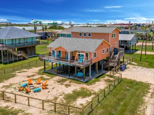 an aerial view of a house with a playground at Hot Tub and Jacuzzi Suite! 100 steps from spacious beach and Jetty park! Generations Retreat Sleeps 26 in Surfside Beach