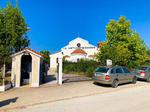 a car parked in front of a church at Zoe in Nea Kalikratia