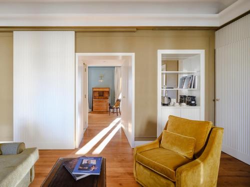 a living room with a couch and a chair at Hotel Regency - Small Luxury Hotels of the World in Florence