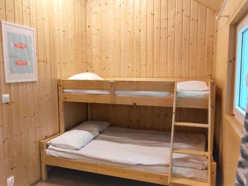 a bunk room with two bunk beds in it at Holiday house near the sea in Pobierowo for 4 people in Pobierowo