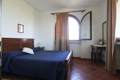 Posteľ alebo postele v izbe v ubytovaní Agriturismo La Steccaia Alta