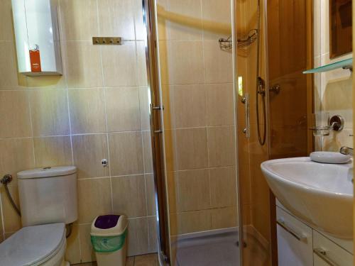 a bathroom with a shower and a toilet and a sink at Holiday house in Pobierowo for 5 people near the sea in Pobierowo