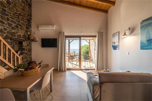 a living room with a couch and a table at Enastron Apartments in Sitia