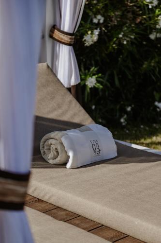 a pillow sitting on top of a bed at Savoy Hotel & Spa - Preferred Hotels & Resorts in Paestum