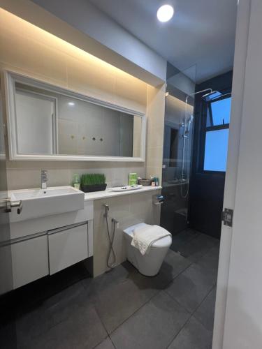 a bathroom with a toilet and a sink and a shower at Setia Sky 88 @D'miko Home Stay in Johor Bahru