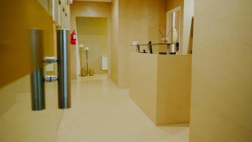a room with a hallway with a counter and a room with at Hotel Canal Beagle in Ushuaia