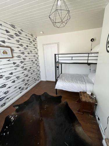 Ένα ή περισσότερα κρεβάτια σε δωμάτιο στο The Bodie Hotel