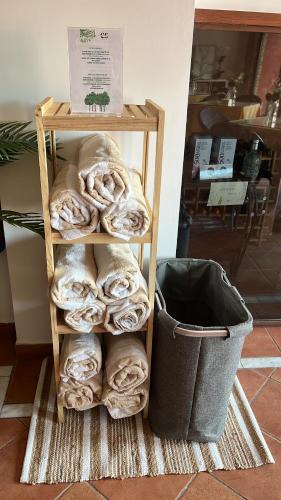 a wooden shelf with a bundle of bread next to a basket at Hotel Boutique Cerro del Sol Adults only recommended in Granada