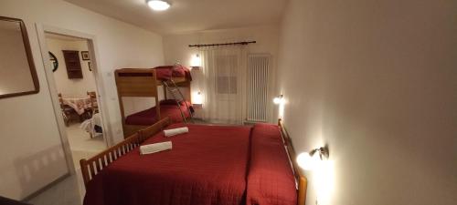 Postel nebo postele na pokoji v ubytování casa floriani fiavè green