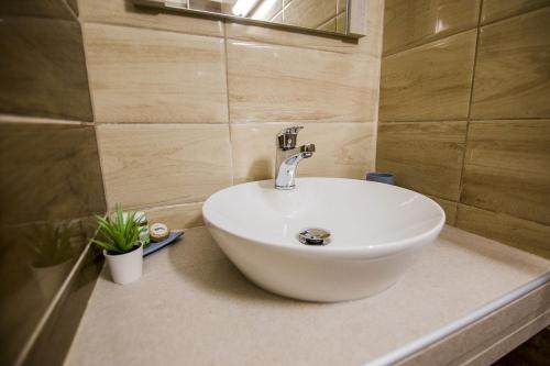 a white sink on a counter in a bathroom at Kasta Beach Hotel in Ofrínion