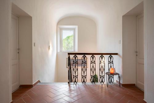 a hallway with a gate with a pumpkin on a table at Agriturismo Terre della Rinascita in Castelnuovo della Misericordia