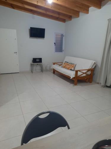 a room with a bed and a table in it at Finca La Chiqueta in Albardón