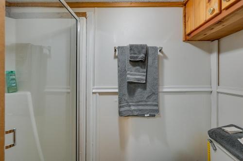 a towel hanging on the door of a refrigerator at Everglades City Trailer Cabin Boat Slip and Porch! in Everglades City