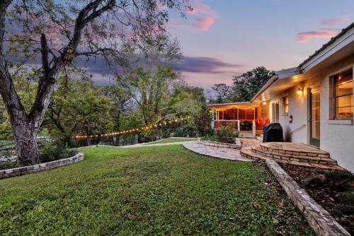 a home with a yard with christmas lights at Luxury Lakefront Oasis with Boat Dock-Firepit in McQueeney