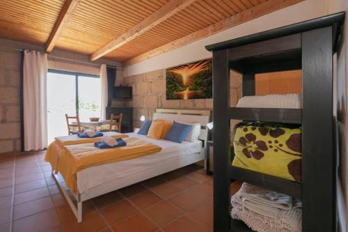 a bedroom with a bed and a bunk bed at Casa Killa in Granadilla de Abona