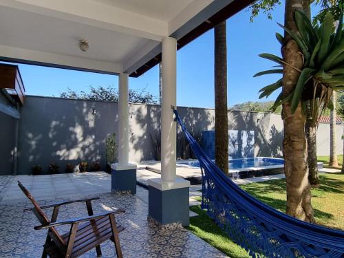 a hammock on the patio of a house at Parada Vale Europeu - Timbó SC in Timbó